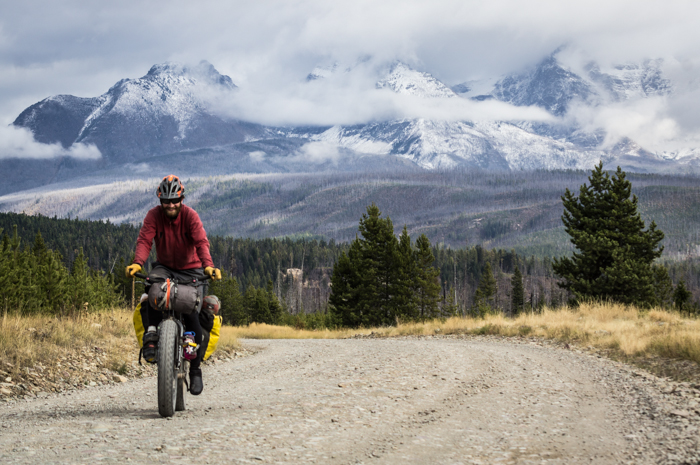 Dave Biking with Glacier National Park Behind